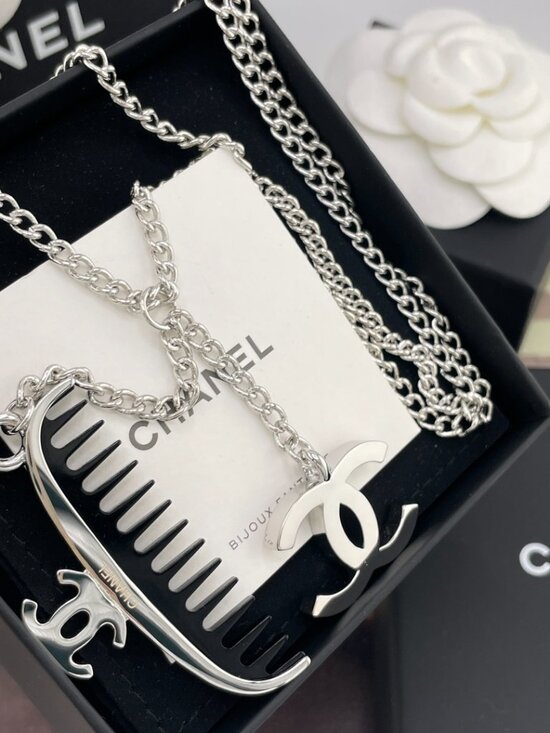 Chanel Silver Toned Embossed CC Pendant Necklace – Addicted  Authentic Chanel Silver Tone Comb & Interlocking CC Logo Pendant Necklace